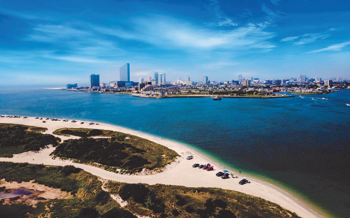 Absecon Inlet with Atlantic City skyline in distance.