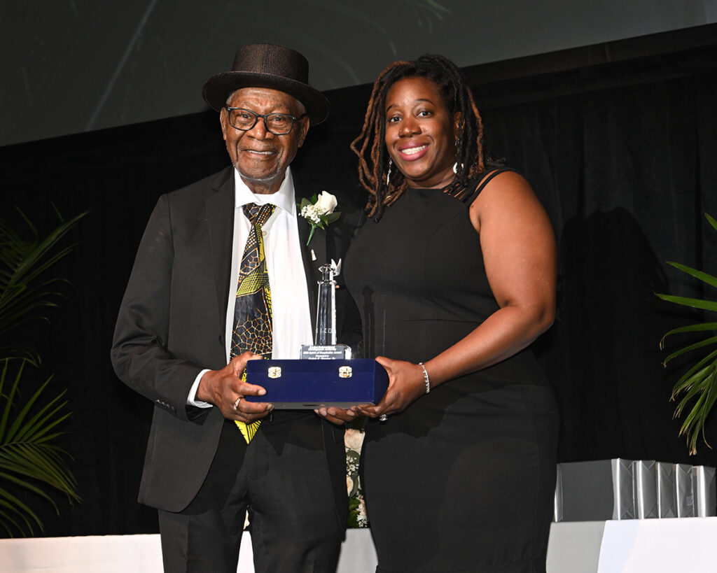 2025 Spirit of Hospitality Award Winner, Ralph E. Hunter, Sr. and CRDA Deputy Executive Director, Maisha Y. Moore together hold up the presented award at the Atlantic City Host Awards held May 7, 2025.